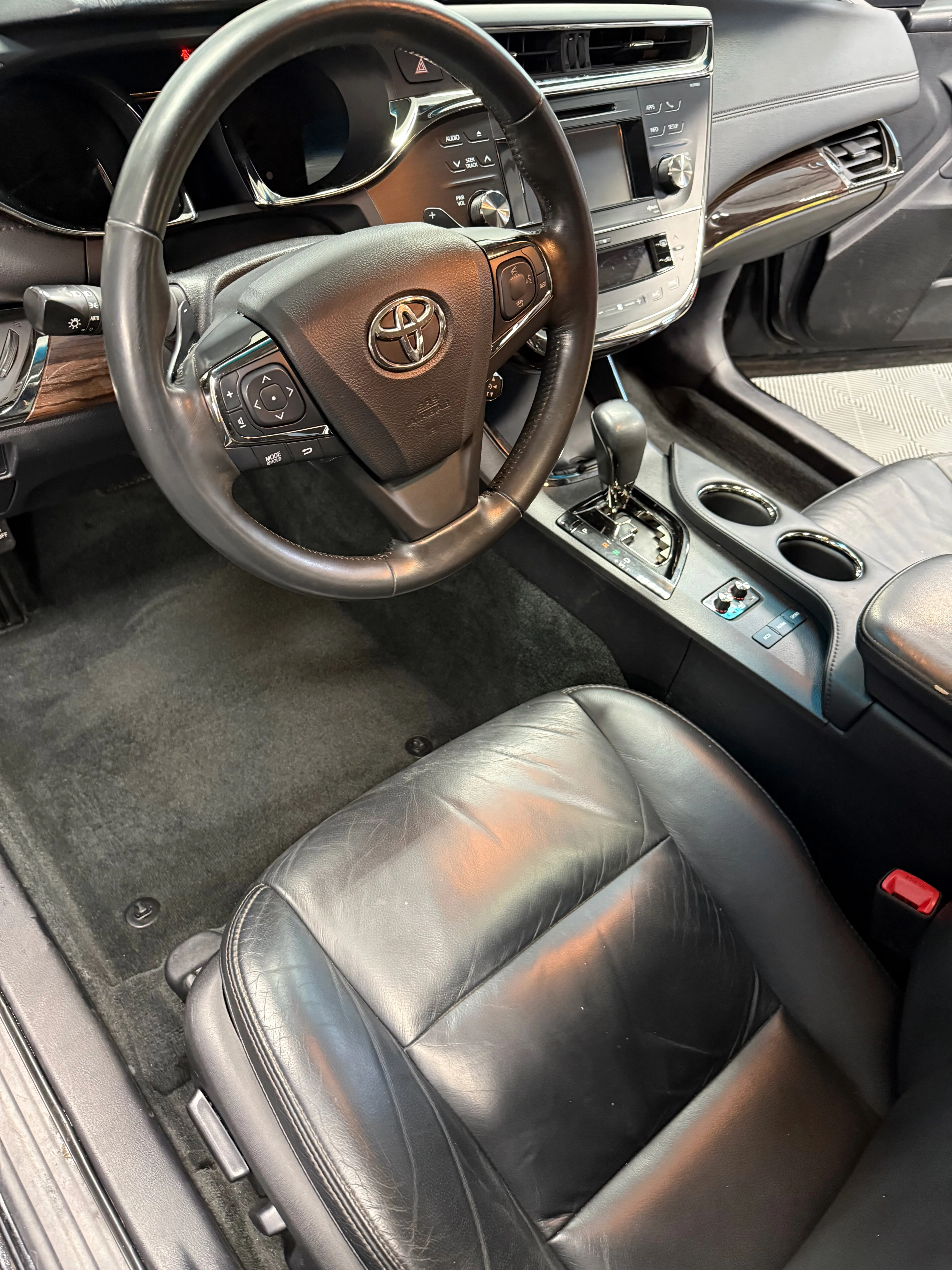 Interior detailing after — Toyota Avalon with clean leather seats and restored carpets