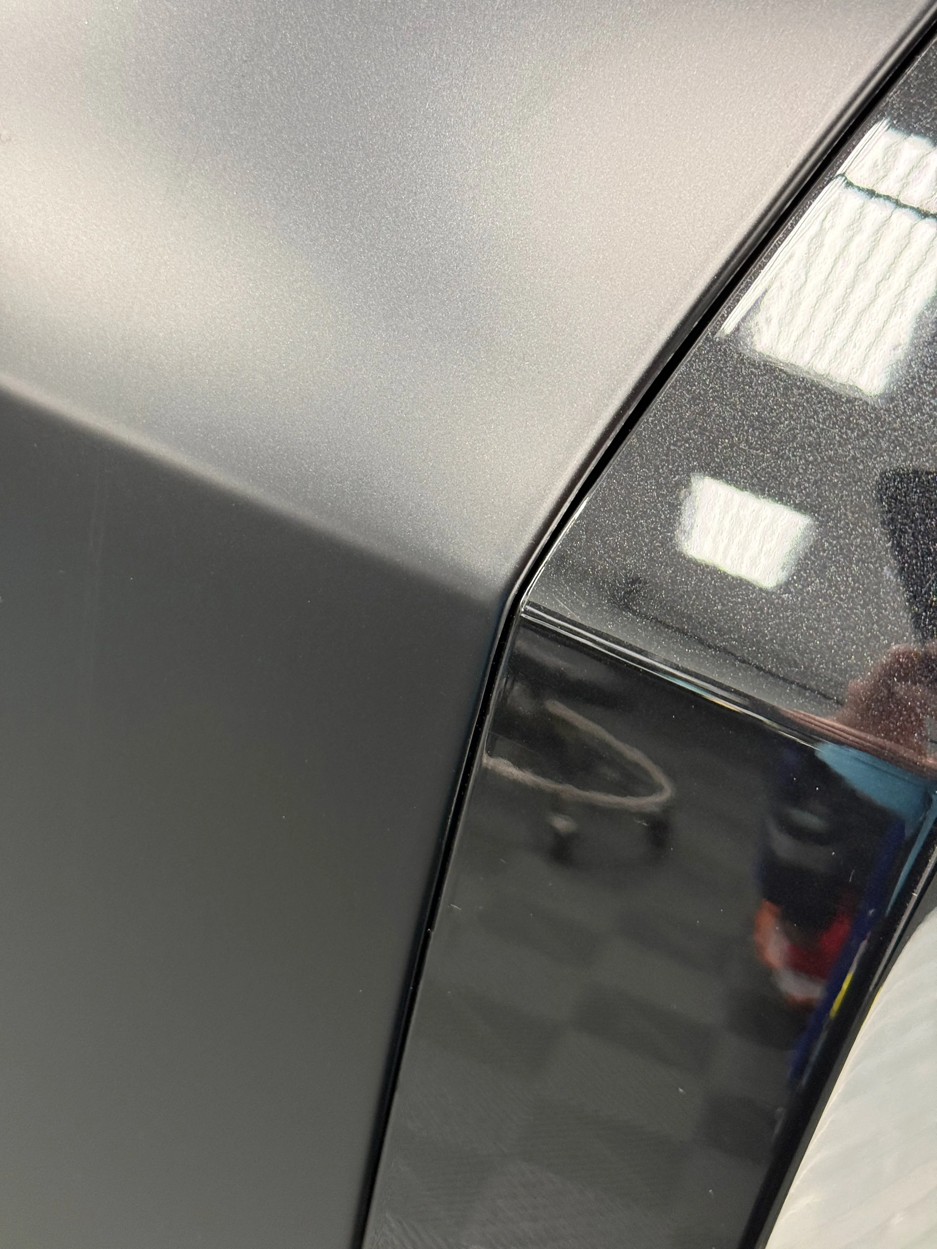 Close-up of precision PPF edge wrap — film tucked around panel for a factory-finish look