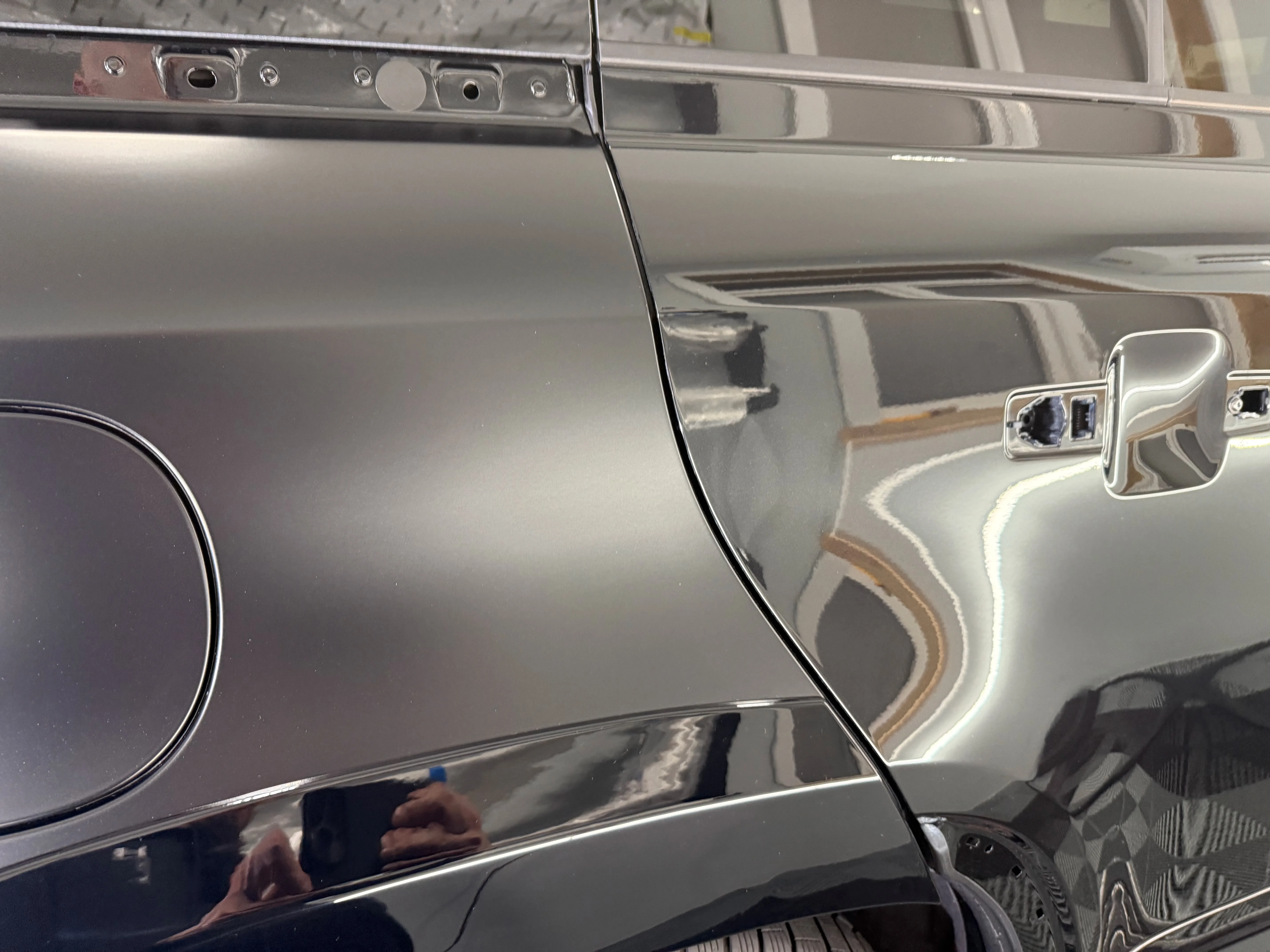 Matte paint protection film close-up showing satin finish next to gloss panel on a Land Rover Defender